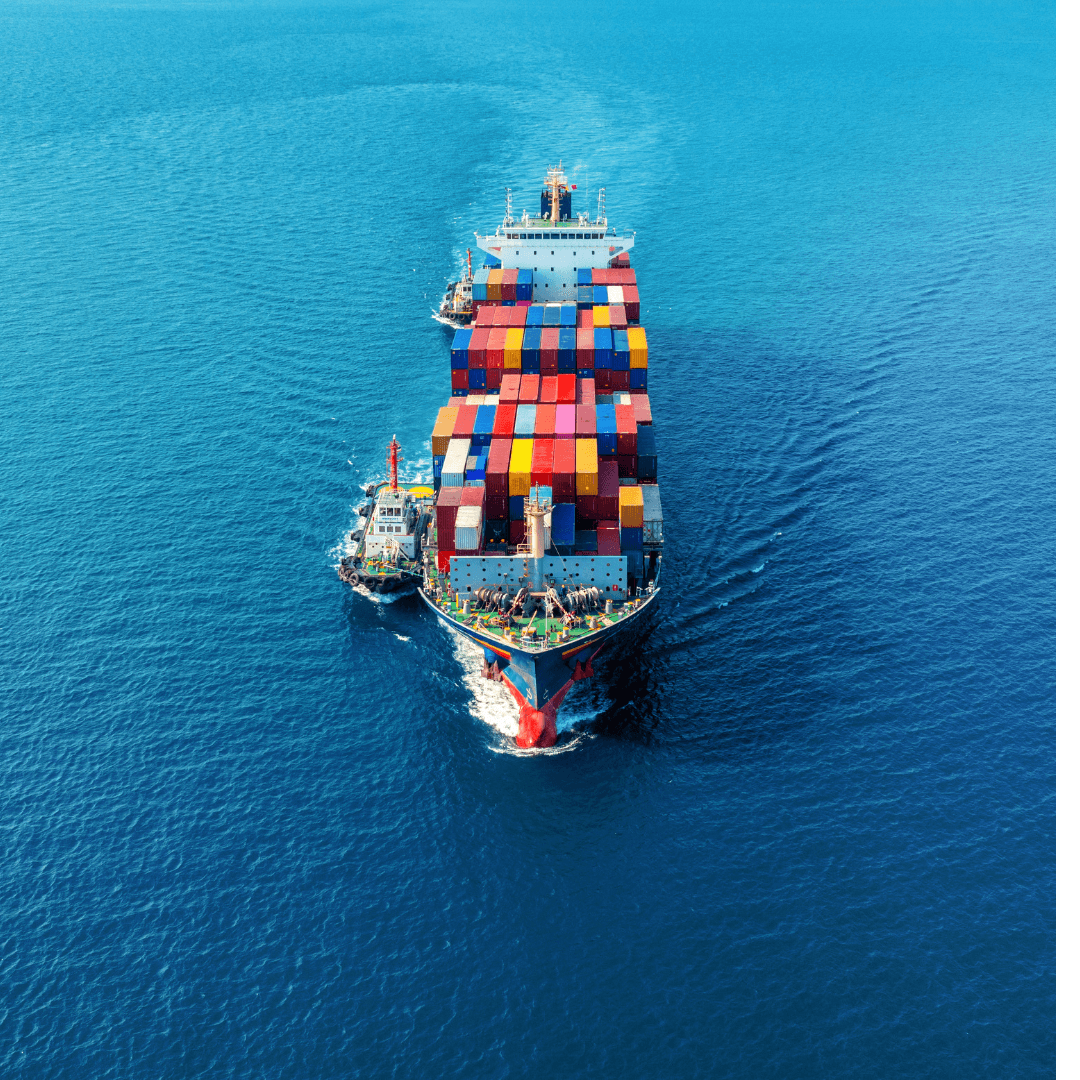 Loaded container vessel underway at sea, viewed from above